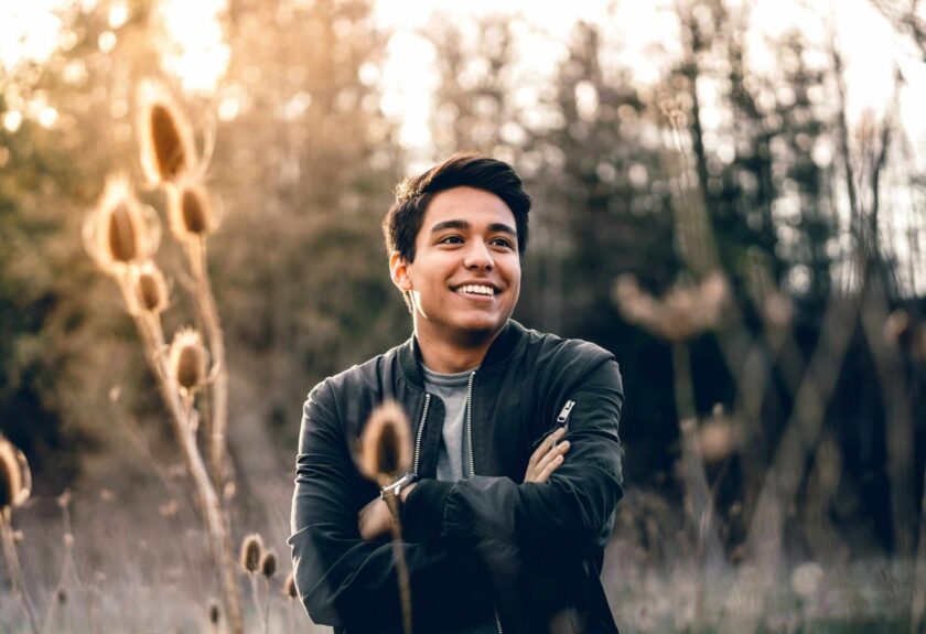 teen boy posing arms crossed